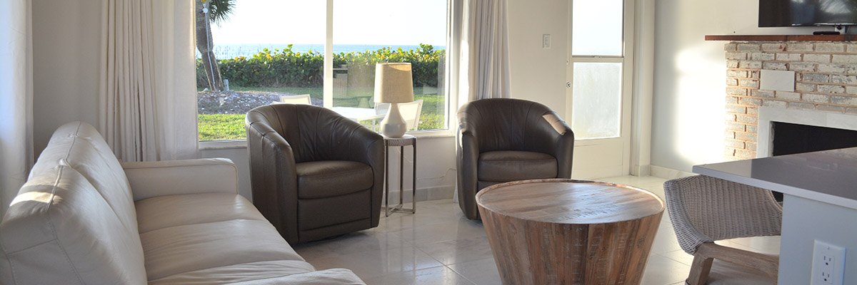 living room of the beach house with beach viewable out the window
